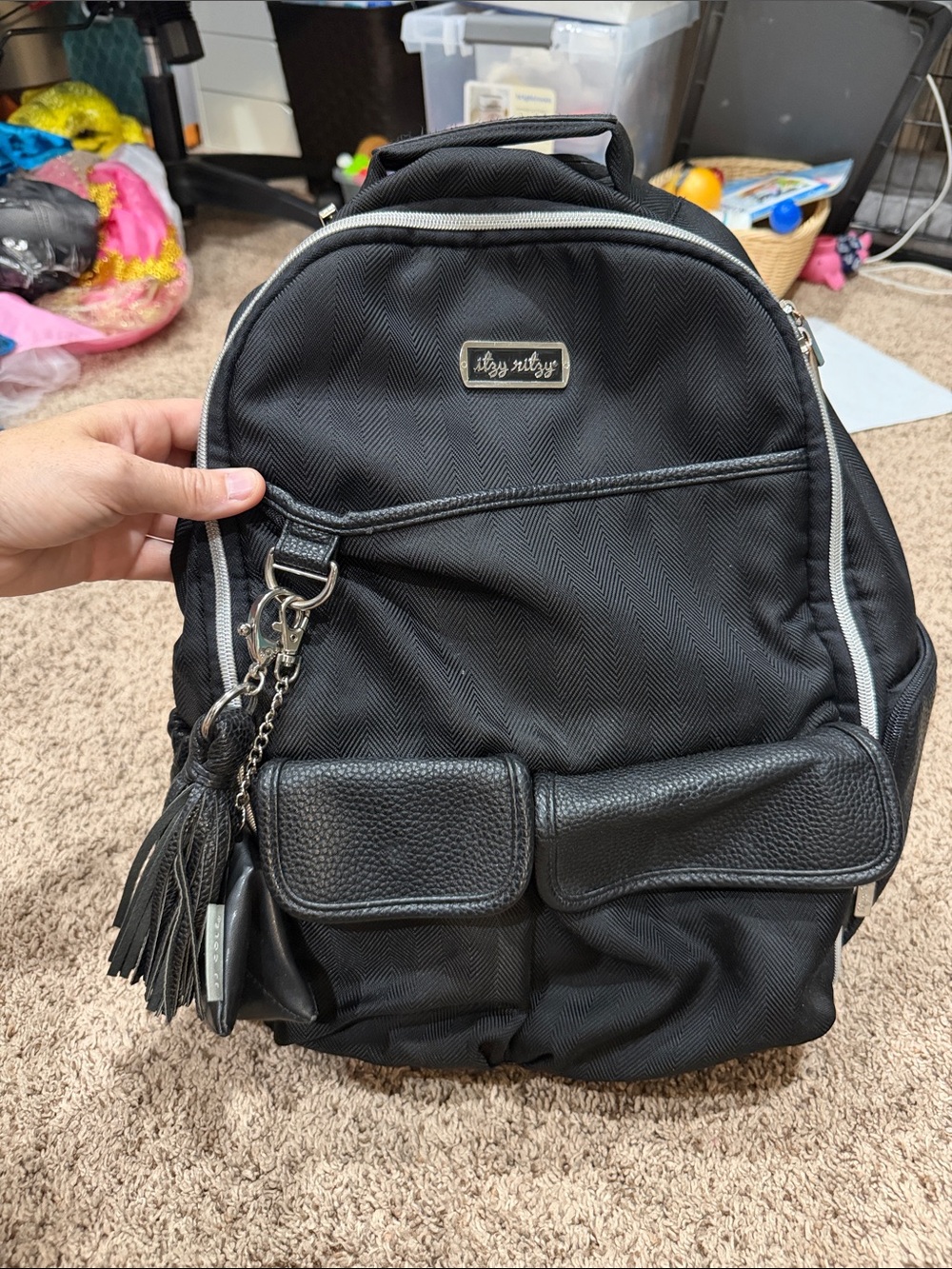 Itzy Ritzy Black Quilted Backpack with Tassel Charm Accent